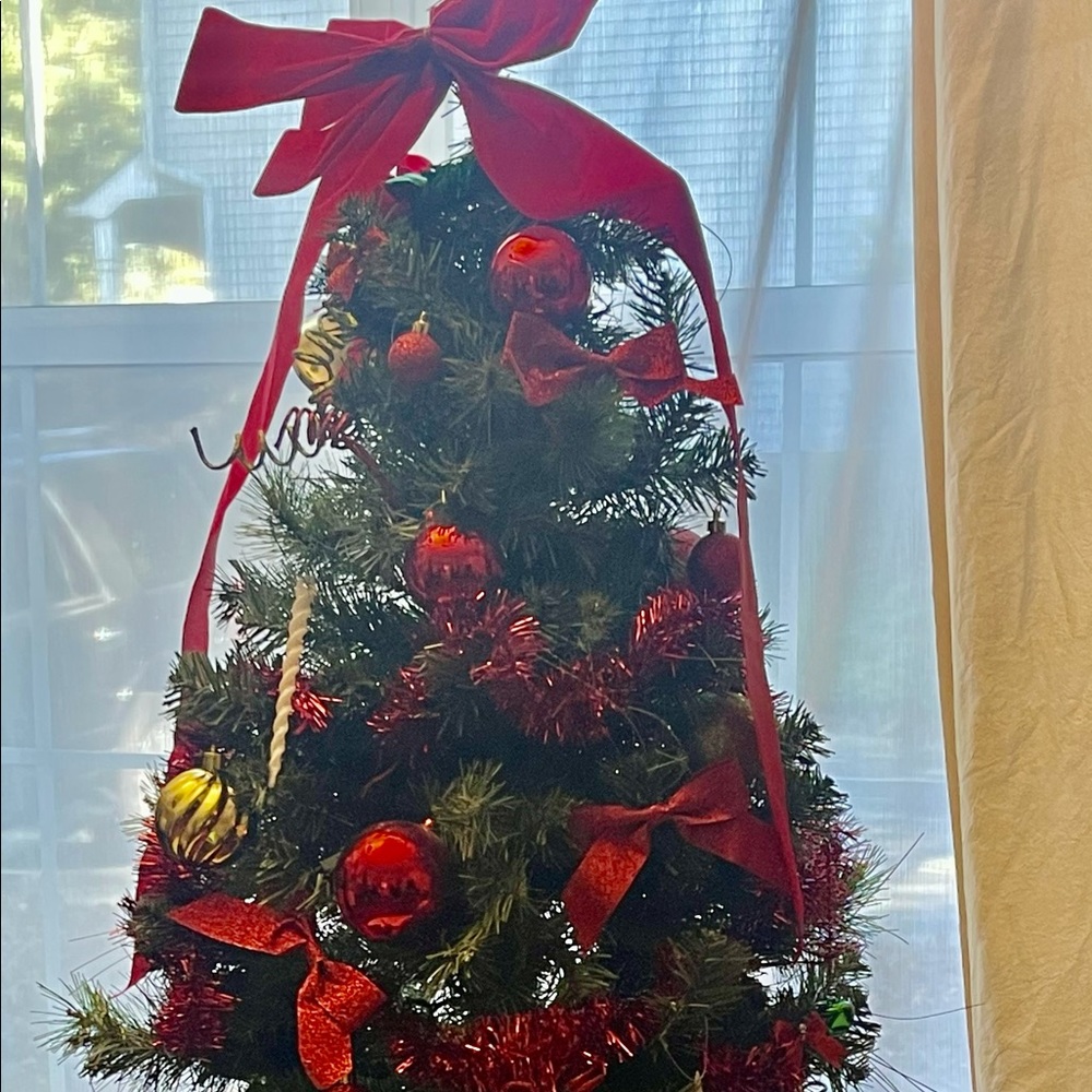 Ruby red artificial holiday tree 🌲. All ornaments, lights, bows, included.